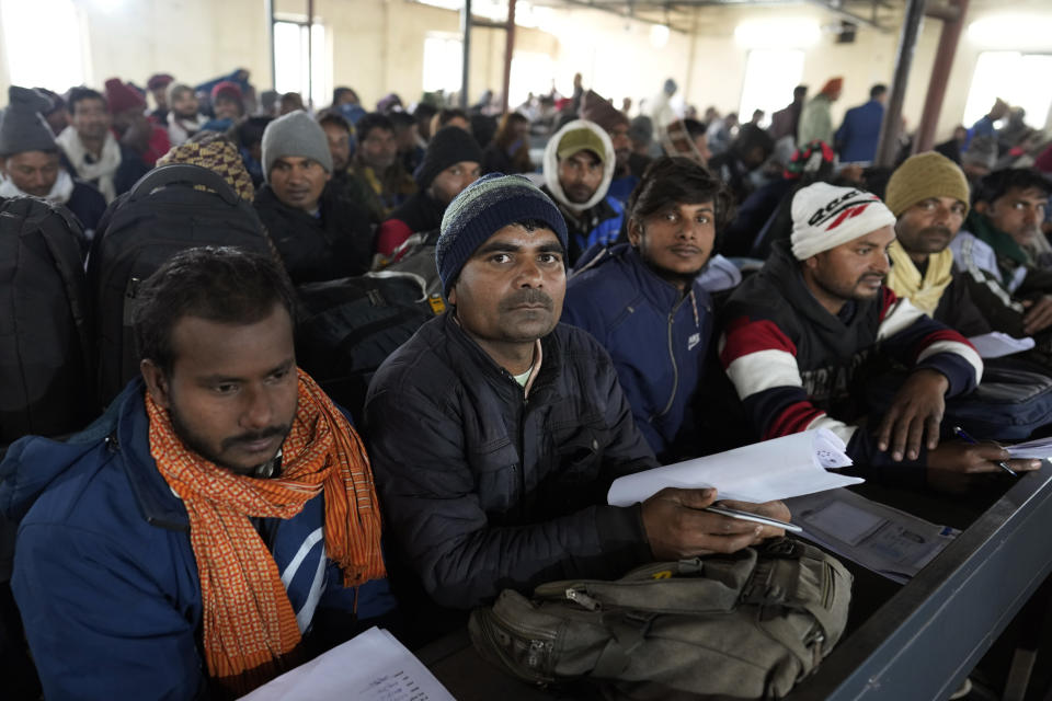 Indian workers aspiring to be hired for jobs in Israel wait to submit their forms during a recruitment drive in Lucknow, India, Thursday, Jan. 25, 2024. (AP Photo/Rajesh Kumar Singh)