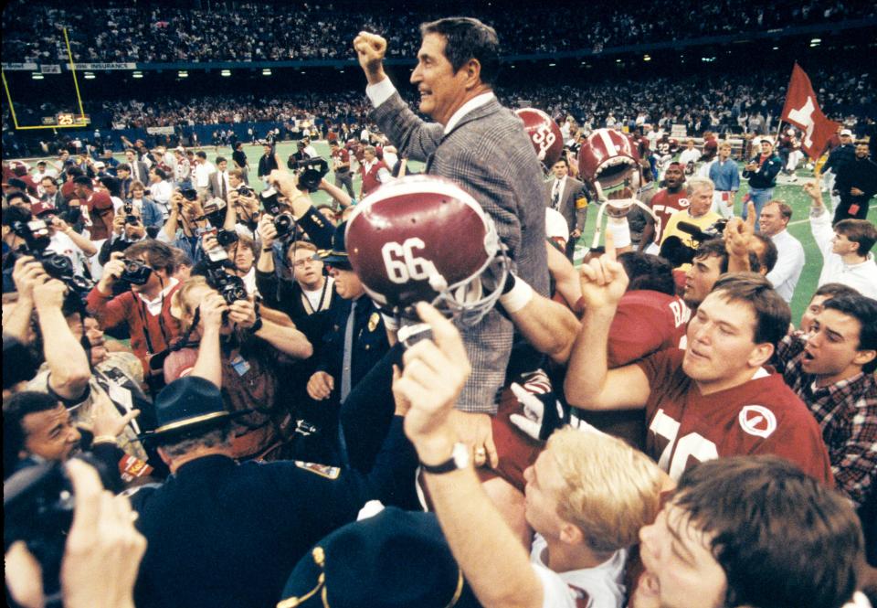 Gene Stallings is lifted up by his players after the Alabama Crimson Tide defeated the Miami Hurricanes in the 1993 Sugar Bowl to secure the national title.