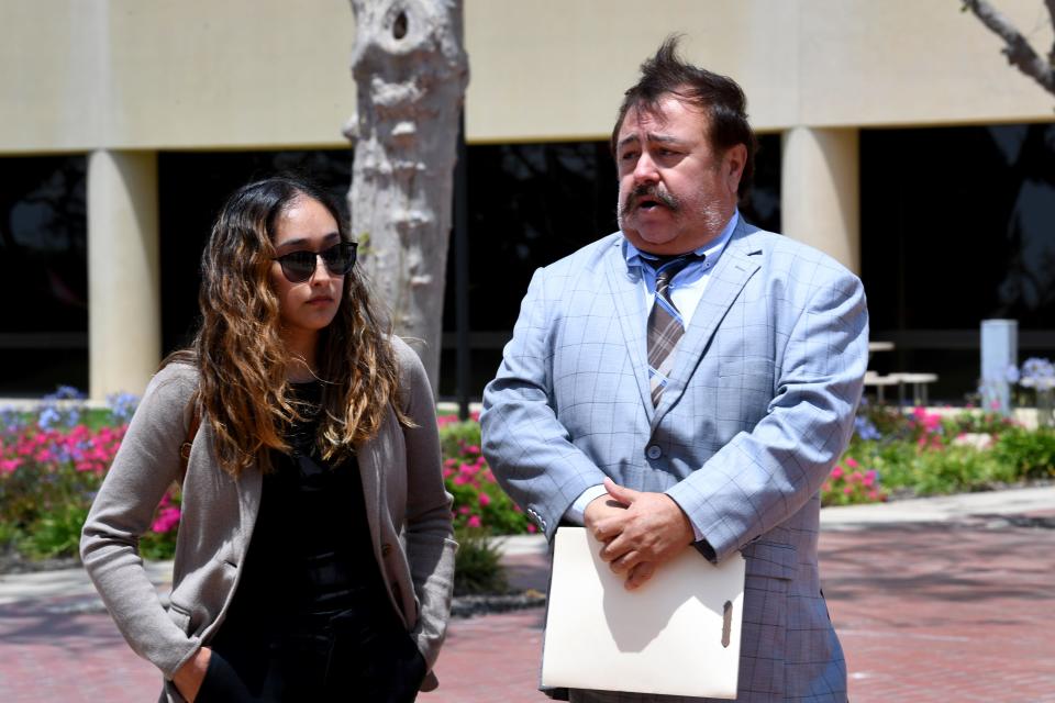 Attorney Greg Ramirez, accompanied by his client Patricia Zavala, speaks during a press conference outside the Ventura County Government Center on Friday.