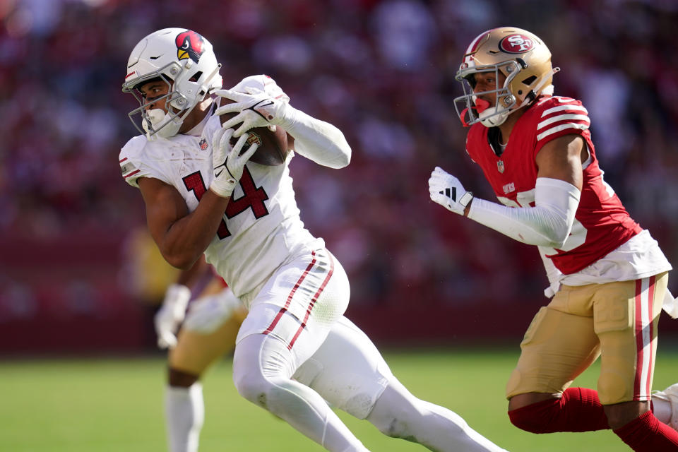 Oct 1, 2023; Santa Clara, California, USA; Arizona Cardinals wide receiver Michael Wilson (14) catches a pass in front of San Francisco 49ers cornerback Isaiah Oliver (26) in the fourth quarter at Levi’s Stadium. Mandatory Credit: Cary Edmondson-USA TODAY Sports