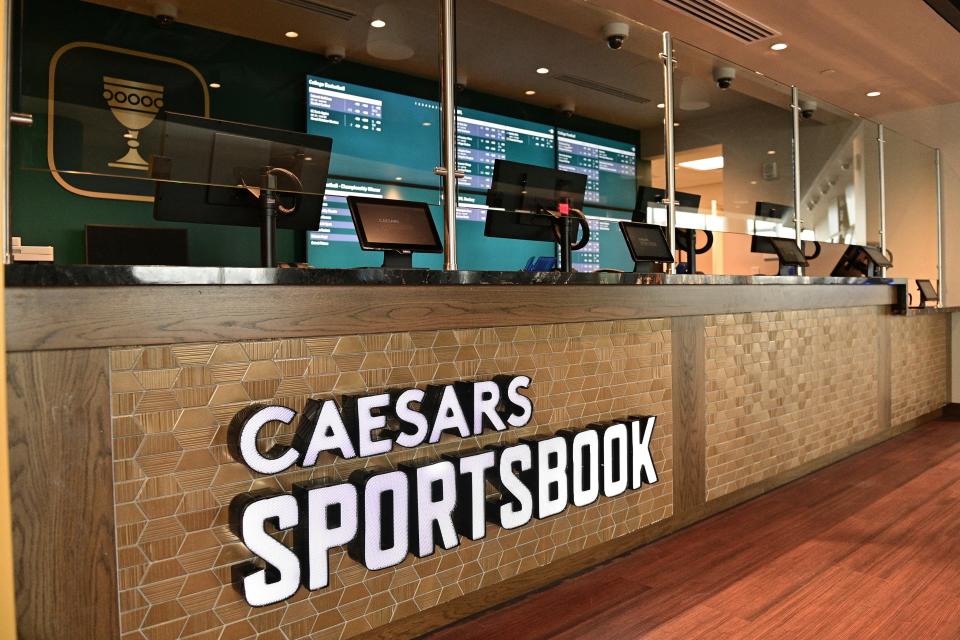 Signage is displayed near the betting window inside Caesars Sportsbook inside Rocket Mortgage FieldHouse, Thursday, Dec. 29, 2022, in Cleveland. With sports gambling becoming legal in Ohio on Jan. 1 at midnight, the Cleveland Cavaliers NBA basketball team is opening a stylish, two-story sports book, where fans can wager on games around the country — as well as the one they're attending. (AP Photo/David Dermer)