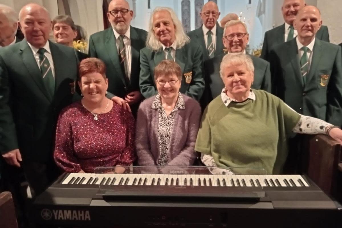 The Musical Team of (left to right) Alyson Griffiths, Carole Rees and Juliet Rossiter supported by choristers following the Pembroke and District Male Voice concert at Angle Church. <i>(Image: PDMVC)</i>