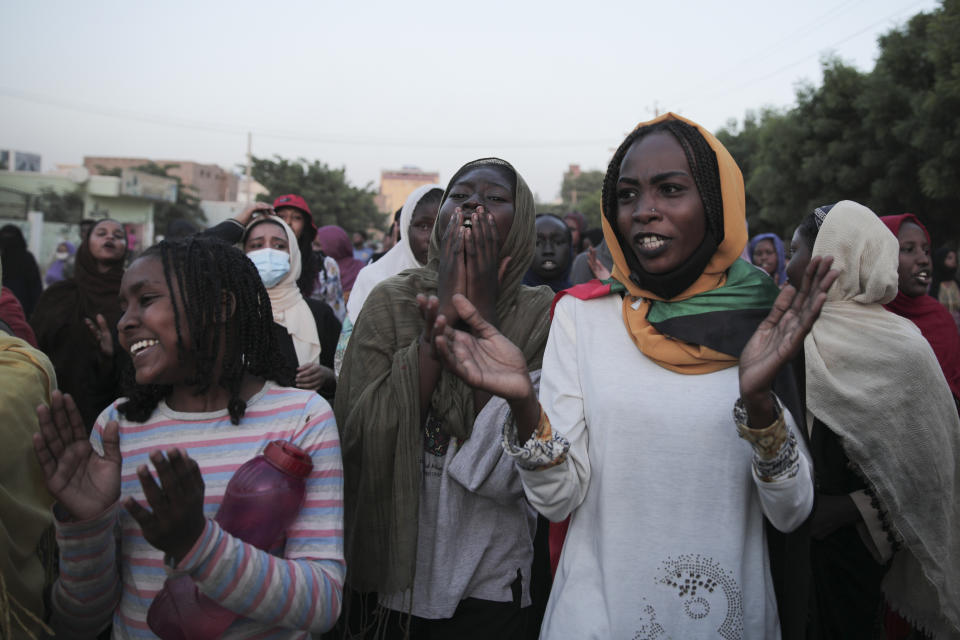 People protest in Khartoum, Sudan, two days after a military coup, Wednesday, Oct. 27, 2021. The coup threatens to halt Sudan's fitful transition to democracy, which began after the 2019 ouster of long-time ruler Omar al-Bashir and his Islamist government in a popular uprising. It came after weeks of mounting tensions between military and civilian leaders over the course and pace of that process. (AP Photo/Marwan Ali)