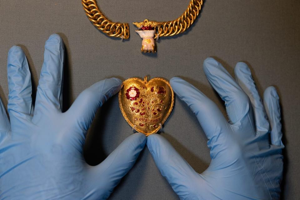 A gold pendant is displayed during a photocall at The British Museum on January 31, 2023 in London, England. The British Museum launches its 2021 Portable Antiquities Scheme (PAS) & Treasure annual reports today. On show were some of the 45,000 treasures reported in 2021 including a Tudor jewel, a chain with a pendant, associated with Henry VIII and his first wife, Katherine of Aragon, m.1509-33. The heart shaped pendant was found by a metal detectorist in Warwickshire.