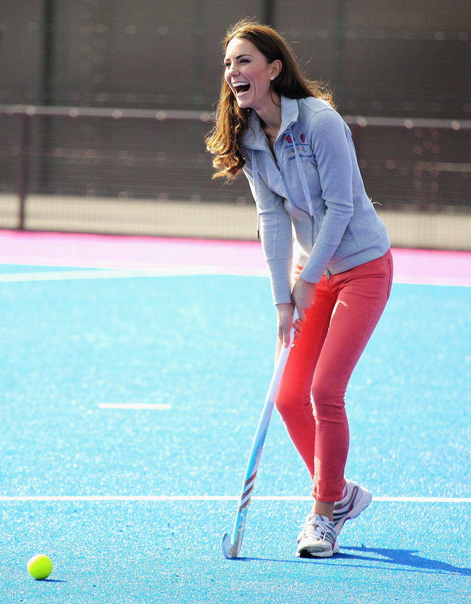 Britain's Duchess of Cambridge laughs as she plays hockey with the British Olympic hockey teams at the Riverside Arena in the Olympic Park, London, Thursday March 15, 2012. The Duchess of Cambridge viewed the Olympic Park and met members of the men's and women's British hockey teams. (AP Photo/Chris Jackson, Pool)