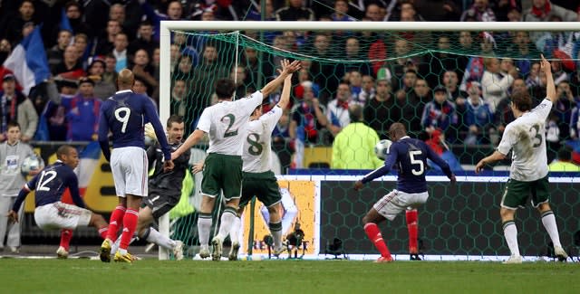 France’s William Gallas (second right) heads home Thierry Henry's cross