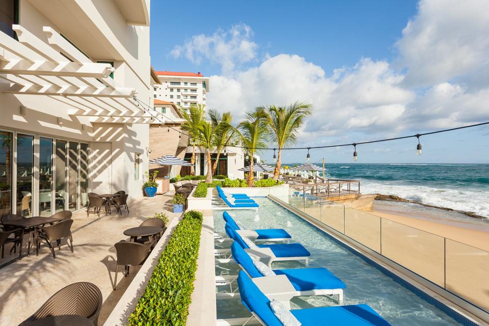 View of the pool and beach at Condado Vanderbilt Puerto Rico