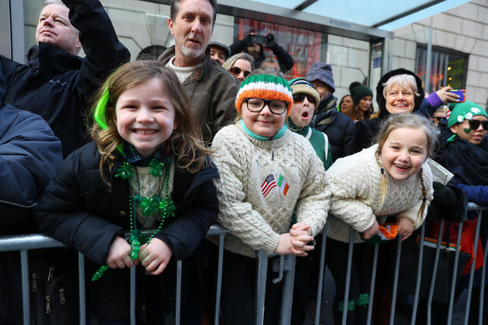 <p>Three youngsters are having fun with the photographer during the St. Patrick’s Day Parade, March 17, 2018, in New York. (Photo: Gordon Donovan/Yahoo News) </p>