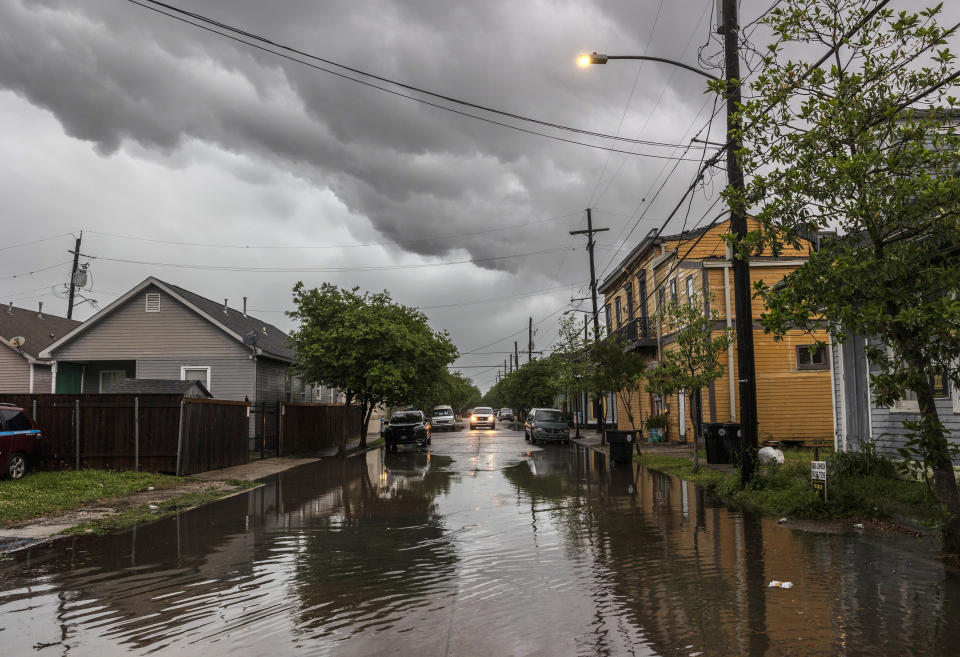 Storm clouds roll across New Orleans as water rises in the Treme neighborhood on Wednesday, April 10, 2024. Severe thunderstorms were expected across parts of the Louisiana, Mississippi, Alabama and the Florida panhandle and there was the potential for tornadoes, a few of which may be strong, and damaging winds, which may exceed 75 mph (120 kph), the National Weather Service warned.(Chris Granger /The Times-Picayune/The New Orleans Advocate via AP)