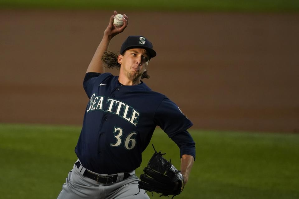 Seattle Mariners starting pitcher Logan Gilbert throws to a Texas Rangers batter during the first inning of a baseball game in Arlington, Texas, Friday, July 30, 2021. (AP Photo/Tony Gutierrez)