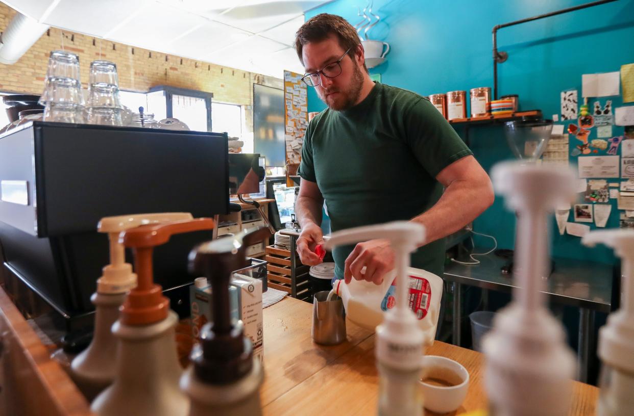 Mike Hastreiter prepares a drink on Thursday at Kavarna Coffeehouse in Green Bay.