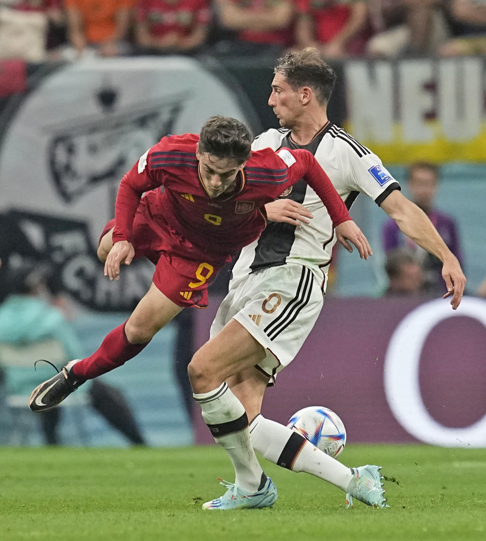 Spain's Gavi dives during a tussle for the ball during the World Cup group E soccer match between Spain and Germany, at the Al Bayt Stadium in Al Khor, Qatar, Sunday, Nov. 27, 2022. (AP Photo/Ebrahim Noroozi)