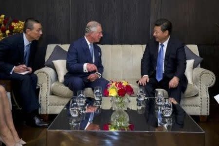 Britain's Prince Charles (C) speaks with China's President Xi Jinping at the Mandarin Oriental hotel in London, Britain October 20, 2015. The president and his wife will be guests of Queen Elizabeth during their state visit to Britain. REUTERS/Justin Tallis/pool