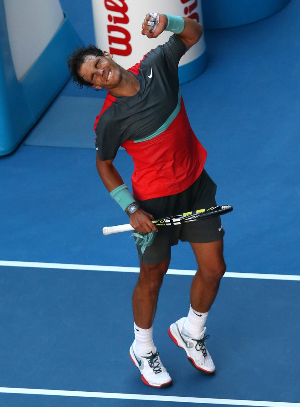 Rafael Nadal of Spain celebrates after defeating Grigor Dimitrov of Bulgaria during their quarterfinal at the Australian Open tennis championship in Melbourne, Australia, Wednesday, Jan. 22, 2014.(AP Photo/Eugene Hoshiko)