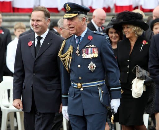 Prince Charles (C) and his wife Camilla (R) join New Zealand PM John Key (L) during Armistice Day commemorations at the Auckland War Memorial on November 11. The royal couple arrived in New Zealand on the last leg of their tour marking Queen Elizabeth II's diamond jubilee