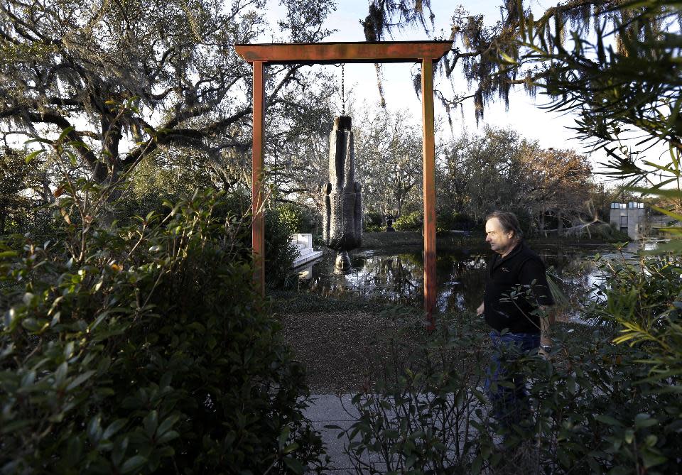 People walk through the Sydney Walda Besthoff Sculpture Garden in City Park in New Orleans, Tuesday, Jan. 15, 2013. The New Orleans Museum of Art is located in the park, and while there's a fee to enter the museum, just beyond the museum are dozens of art objects you can see for free in the Sydney and Walda Besthoff Sculpture Garden. The sculptures, valued at more than $25 million, can be viewed in a relaxing setting that includes meandering footpaths, pedestrian bridges and reflecting lagoons. (AP Photo/Gerald Herbert)