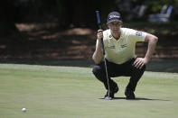 Webb Simpson lines up a shot on the first green during the final round of the RBC Heritage golf tournament, Sunday, June 21, 2020, in Hilton Head Island, S.C. (AP Photo/Gerry Broome)