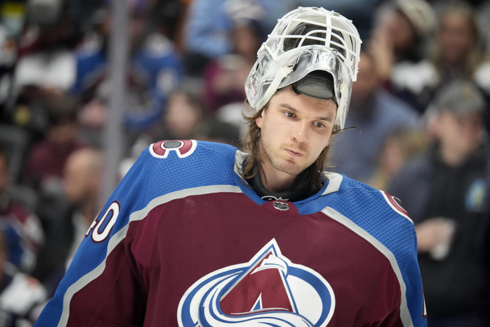 Colorado Avalanche goaltender Alexandar Georgiev waits for play to resume in the second period of an NHL hockey game against the Vancouver Canucks on Wednesday, Nov. 22, 2023, in Denver. (AP Photo/David Zalubowski)