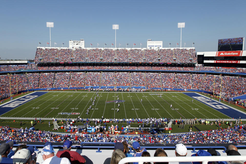 FILE - In this Sept. 24, 2017, file photo, fans watch during the second half of an NFL football game between the Buffalo Bills and the Denver Broncos at New Era Field in Orchard Park, N.Y. The Bills have informed county officials they will not use an early and one-time opt-out clause to terminate their lease at New Era Field. The team's decision, sent in a letter to Erie County Executive Mark Poloncarz on Friday, Jan. 31, 2020, was considered a formality, but in no way rules out the possibility of the Bills one day playing at new facility in downtown Buffalo. (AP Photo/Jeffrey T. Barnes, File)