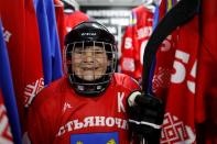 Valentina Fyodorova, 80, the captain of a senior women's hockey team, poses for a photo before a match in Bereznik