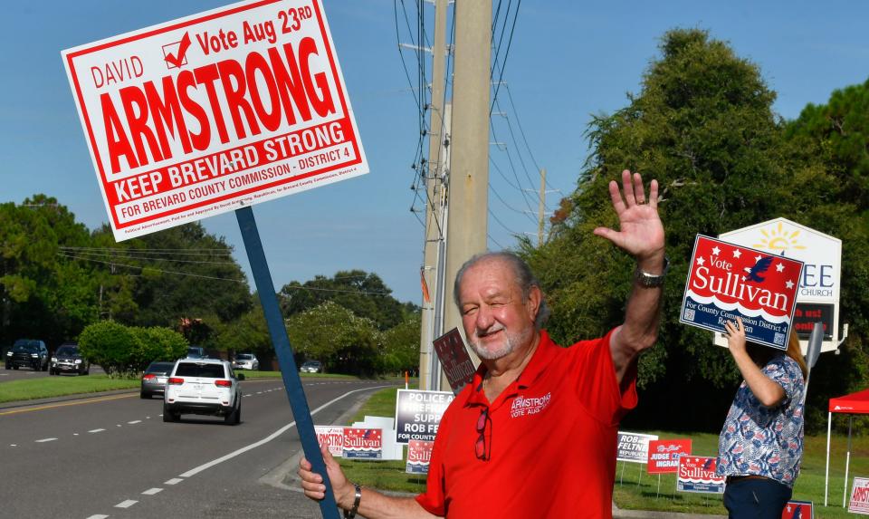  Dave Armstrong, candidate for County Commissioner, on Wisckham Road in front of Suntree United Methodist Church, where precincts were located. 