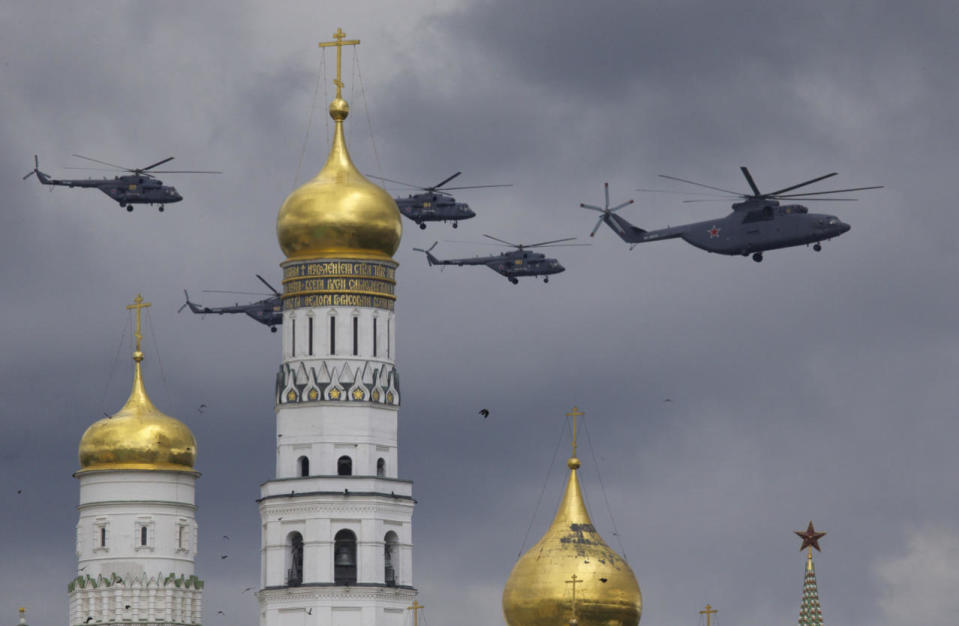 Russian military helicopters fly over Ivan the Great bell-tower and Moscow’s Kremlin during a general rehearsal for the Victory Day military parade which will take place at Moscow’s Red Square on May 9 to celebrate 71 years after the victory in WWII in Moscow, Russia, May 5, 2016. (Ivan Sekretarev/AP)