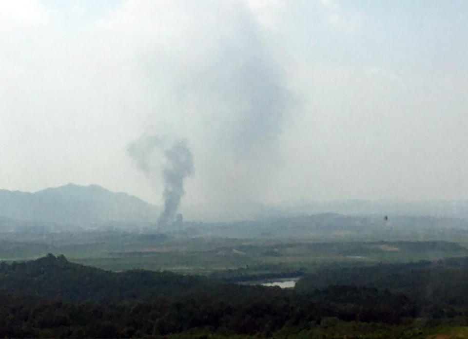 Smoke rises in the North Korean border town of Kaesong, seen from Paju, South Korea, Tuesday, June 16, 2020. South Korea says that North Korea has exploded an inter-Korean liaison office building just north of the tense Korean border. (Yonhap via AP)