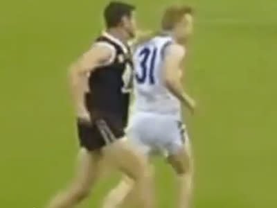 Footage of a shocking Aussie Rules sucker punch in the Sydney Premier Division went viral after being posted online. A Western Suburbs Magpies player can be seen chasing his opponent before throwing a left hook that instantly knocked the player out.