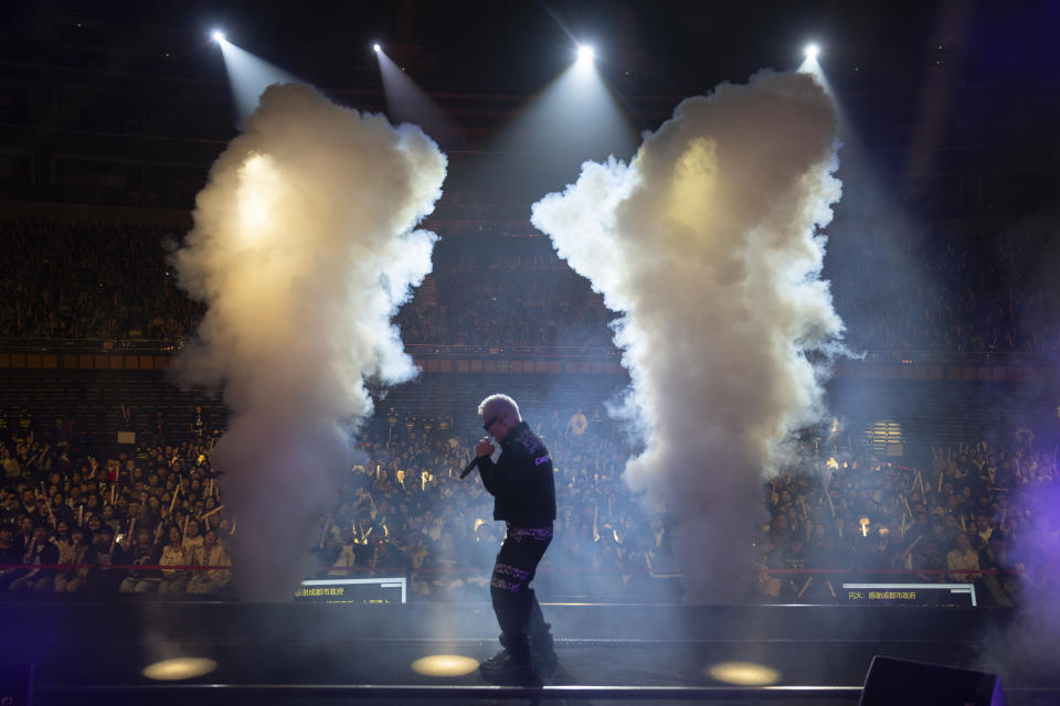 Chinese rapper Boss X performs at a concert in Chengdu in southwestern China's Sichuan province, Saturday, March 16, 2024. The rapper, who had come up from making music in a run-down apartment in an old residential community in the city, was now playing to a stadium of thousands. (AP Photo/Ng Han Guan)