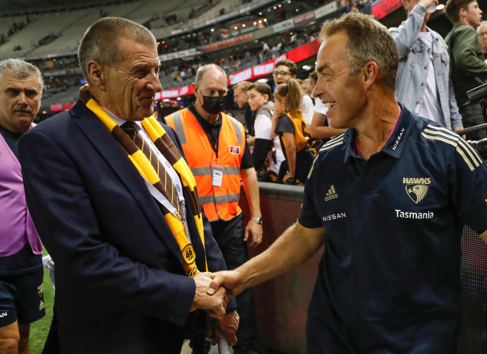 Pictured here, Hawthorn president Jeff Kennett and former coach Alastair Clarkson shaking hands.