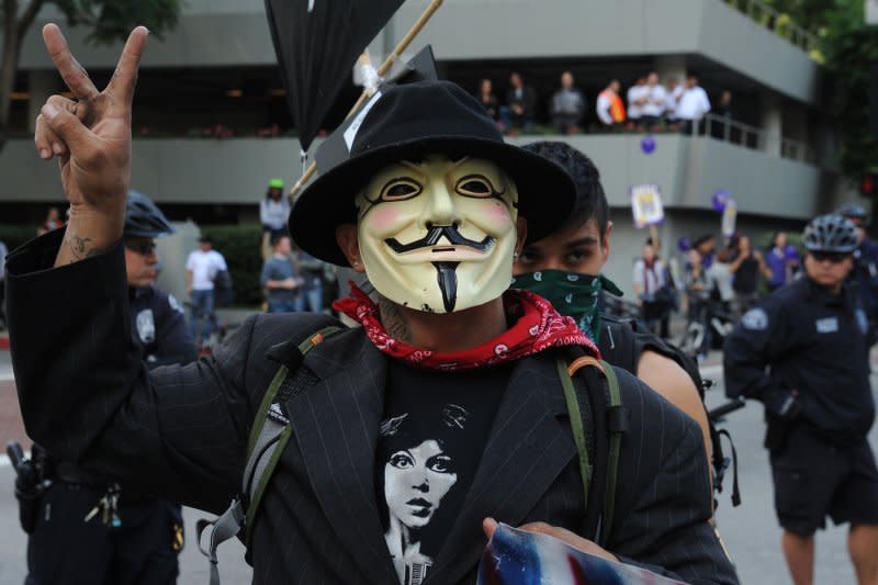 An Occupy LA protester wears a Guy Fawkes mask during a demonstration on November 17, 2011. On November 5, 1605, Guy Fawkes and fellow conspirators attempted to blow up the English Parliament and failed. Britain celebrates Guy Fawkes day -- November 5 -- each year with bonfires and fireworks. But the traditional Fawkes mask has been co-opted by anti-government, anti-establishment groups across the globe. File Photo by Jim Ruymen/UPI