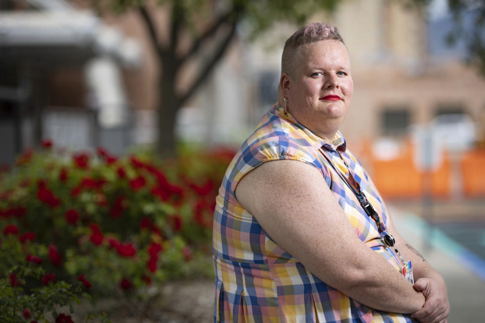 June Meissner poses for a photo at the Boise Public Library in Boise, Idaho on Thursday, June 6, 2024. Meissner, a transgender woman and librarian, blocked a punch from a man yelling slurs while working at the library. (AP Photo/Kyle Green)