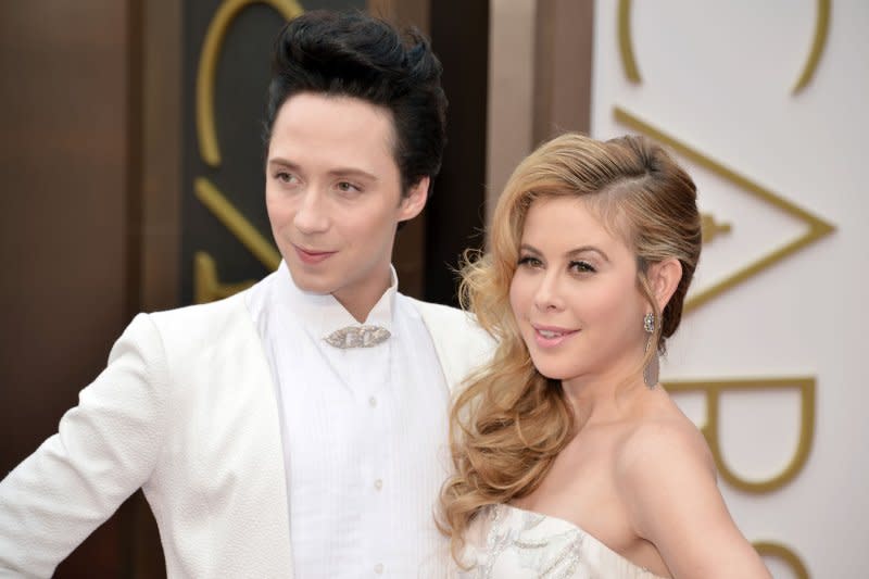 Tara Lipinski (R) and Johnny Weir attend the Academy Awards in 2014. File Photo by Kevin Dietsch/UPI