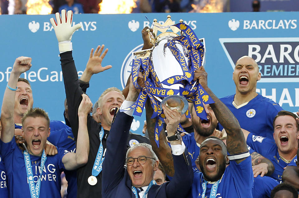 Britain Soccer Football - Leicester City v Everton - Barclays Premier League - King Power Stadium - 7/5/16  Leicester City's Wes Morgan and manager Claudio Ranieri lift the trophy as they celebrate winning the Barclays Premier League  Action Images via Reuters / John Clifton  Livepic  EDITORIAL USE ONLY. No use with unauthorized audio, video, data, fixture lists, club/league logos or "live" services. Online in-match use limited to 45 images, no video emulation. No use in betting, games or single club/league/player publications.  Please contact your account representative for further details.