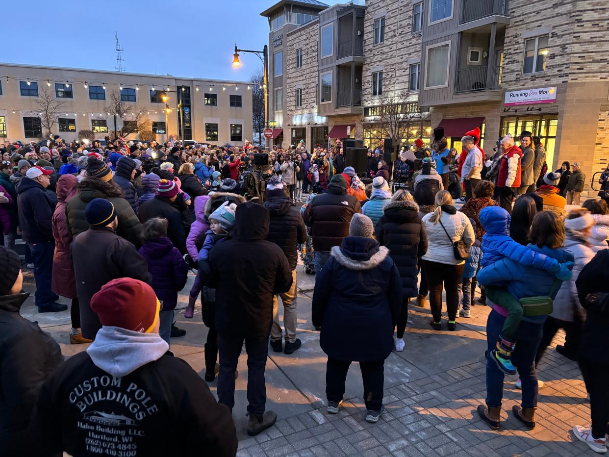 Hundreds of people gather to watch the 76th annual Groundhog Day Prognostication Event at sunrise on Friday, February 2, 2024, in downtown Sun Prairie, Wisconsin.
