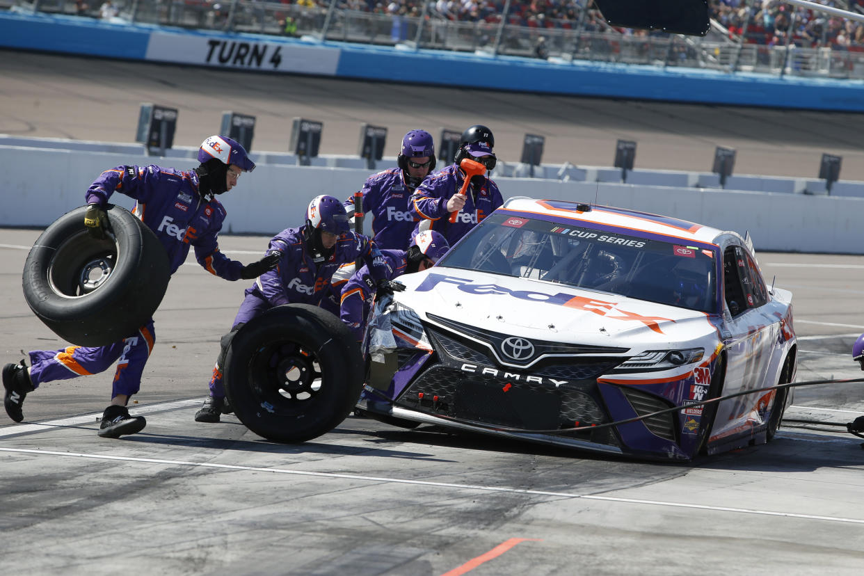 A mistake triggered a four-race ban for three members of Denny Hamlin's crew. (AP Photo/Ralph Freso)