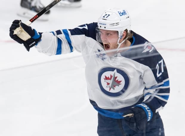 Nikolaj Ehlers celebrates his goal against the Toronto Maple Leafs on Thursday. He was injured when the teams met again on Saturday. (Frank Gunn/The Canadian Press - image credit)