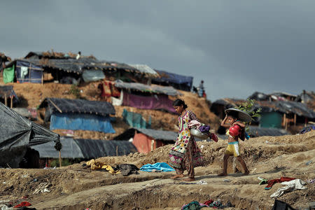 Rohingya refugee children walk through a camp at Cox's Bazar, Bangladesh, September 26, 2017. REUTERS/Cathal McNaughton