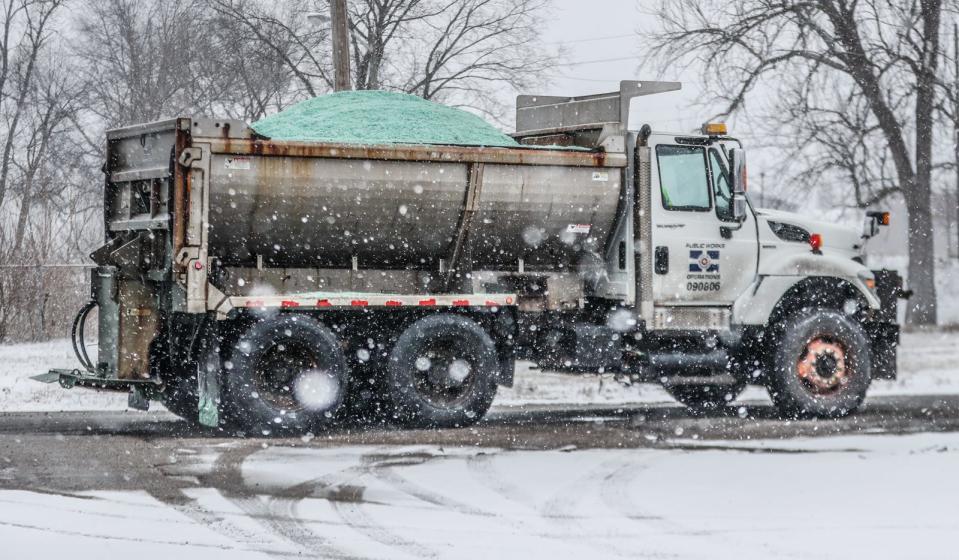 Salt trucks are loaded on Friday, Jan. 28, 2022, near the intersection of Washington St. and Tibbs Ave.  in Indianapolis. 