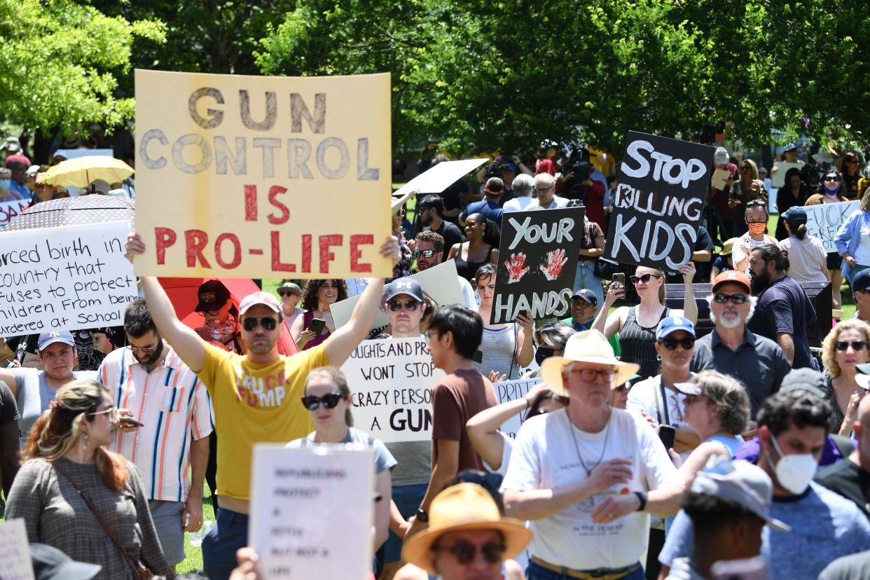 Gun rights activists and supporters protest outside the National Rifle Association Annual Meeting at the George R. Brown Convention Center, on May 27, 2022, in Houston, Texas. - America's powerful National Rifle Association kicked off a major convention in Houston Friday, days after the horrific massacre of children at a Texas elementary school, but a string of high-profile no-shows underscored deep unease at the timing of the gun lobby event. (Photo by Patrick T. FALLON / AFP) (Photo by PATRICK T. FALLON/AFP via Getty Images)