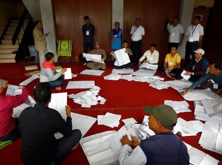 Officials from the election commission count votes a day after the local election of municipalities and villages representatives in Kathmandu, Nepal May 15, 2017. REUTERS/Navesh Chitrakar