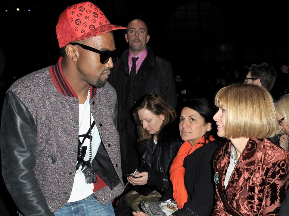 Kanye West and Anna Wintour attend the Givenchy Ready-to-Wear A/W 2009 fashion show during Paris Fashion Week at Carreau du Temple on March 8, 2009 in Paris, France.