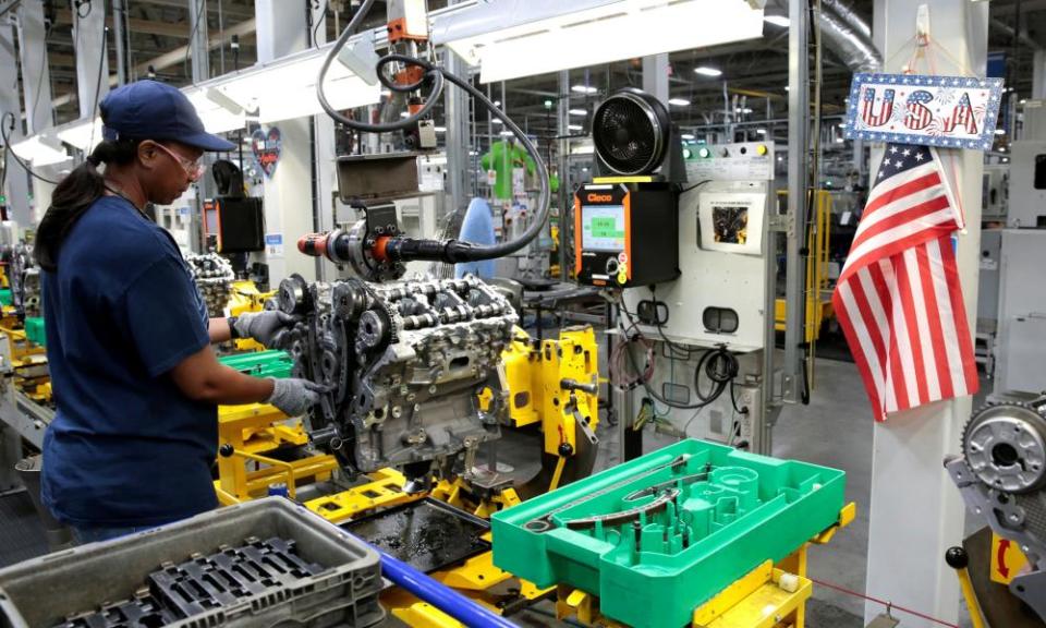 A General Motors assembly worker works on assembling a V6 engine last year. The ventilator operation will look significantly different.