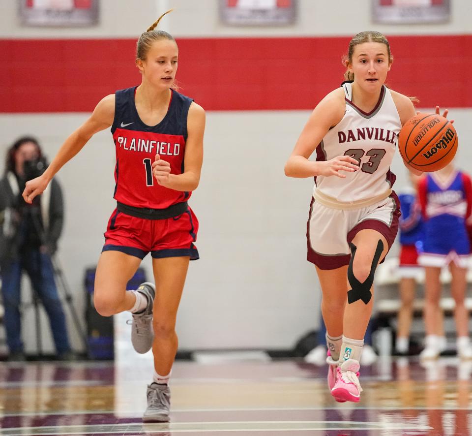 Danville's guard Emma Ancelet (33) rushes up the court against Plainfield Quakers guard Ellison Stewart (1) on Saturday, Jan. 6, 2024, during the game at Danville Community High School in Danville.