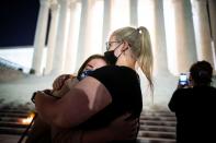 People gather outside of the U.S. Supreme Court following the death of U.S. Supreme Court Justice Ruth Bader Ginsburg, in Washington