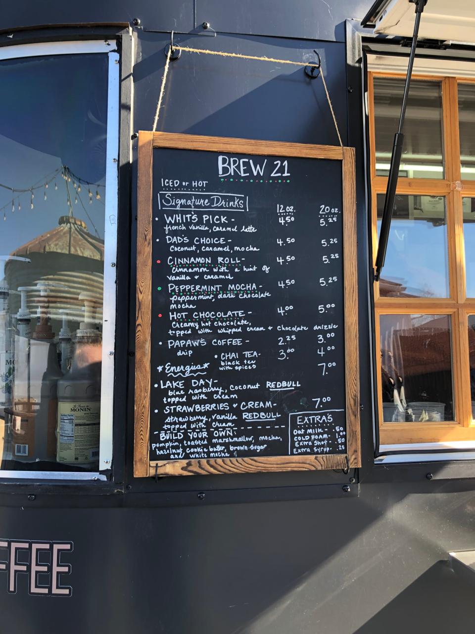 The Brew 21 Extra Chromosome Coffee Company menu hangs outside the trailer at the 417 Tattoo Collaborative Flash Bash in Fair Grove on Jan. 20, 2023.