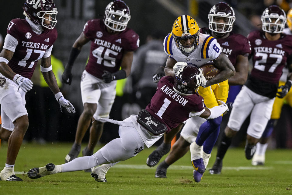 Nov 26, 2022; College Station, Texas; Texas A&M Aggies defensive back Bryce Anderson (1) and LSU Tigers wide receiver Malik Nabers (8) in action during the game between the Texas A&M Aggies and the LSU Tigers at Kyle Field. Jerome Miron-USA TODAY Sports