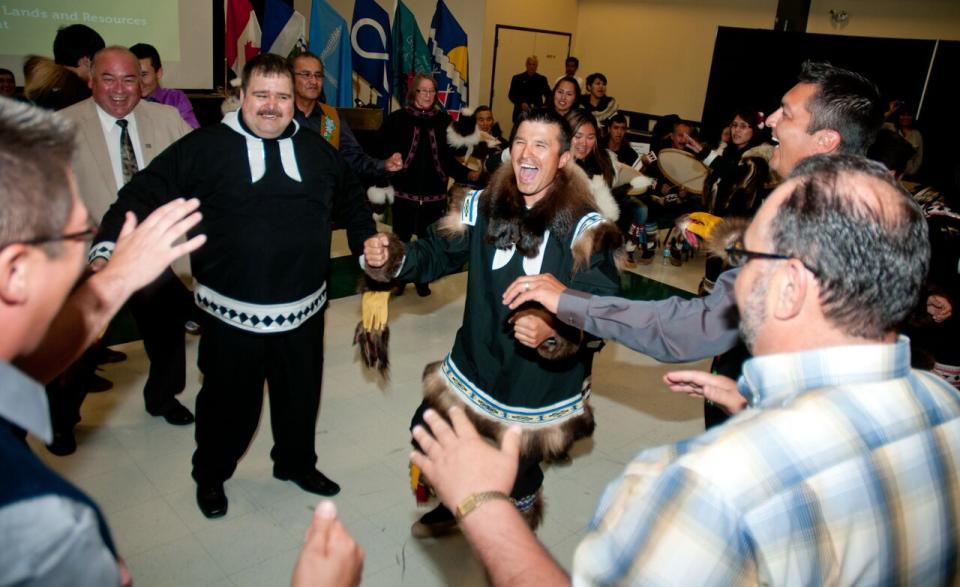 Politicians and local drummers celebrate at the signing of the devolution agreement in Inuvik, N.W.T., on June 25, 2013.