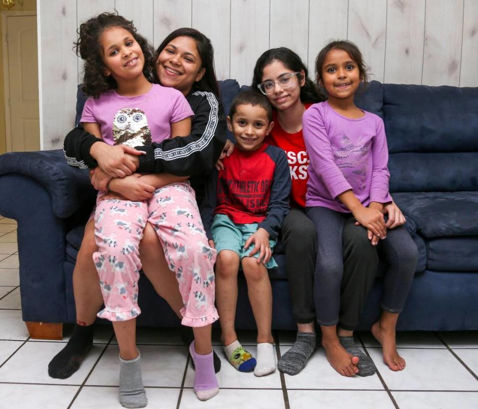 The Santana siblings, from left, Jaseline, 8, Jasmine, 22, Janthony, 6, Janelly 18, and Janabella, 7, in their North Miami home ion Dec. 6, 2022. That year, a Wish Book donor offered rental assistance for the family after the Herald told how Jasmine Santana, 22, had taken in her four younger siblings to avoid having them placed in foster care.