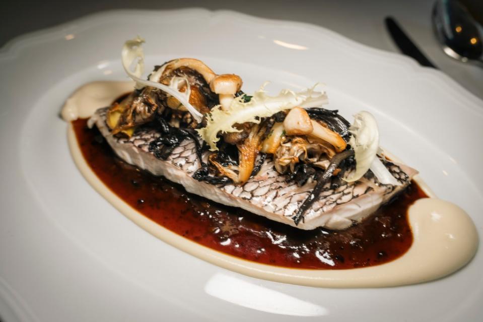 One of the most popular dishes is straight out of Carmellini’s French-trained playbook: black bass forestiere ($52), the fish steamed with fresh yuzu and wild mushrooms and served in a soul-satisfying mushroom truffle sauce. Stefano Giovannini